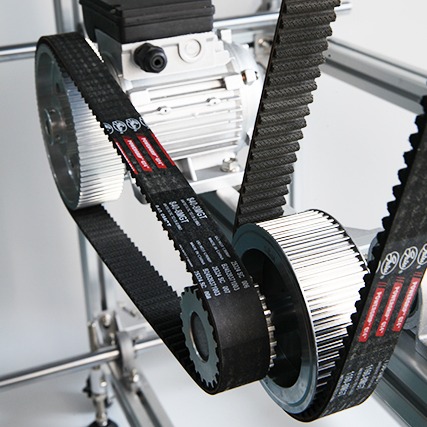 GT profile timing belt meshing with a toothed pulley for accurate, low-backlash power transmission.