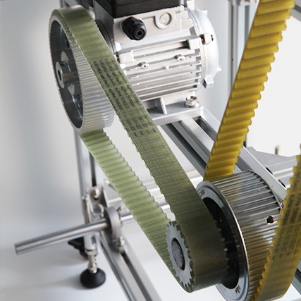 Polyurethane PU timing belt running on a toothed pulley for precise industrial drive applications.